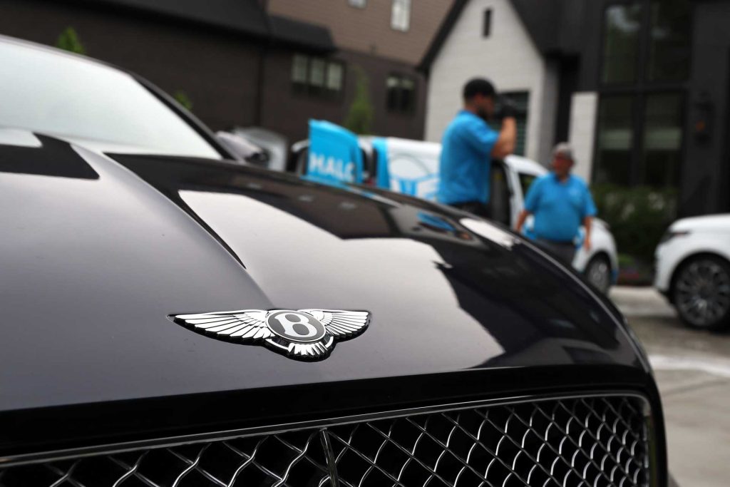 Bentley emblem on black hood during luxury car detailing service in Nashville