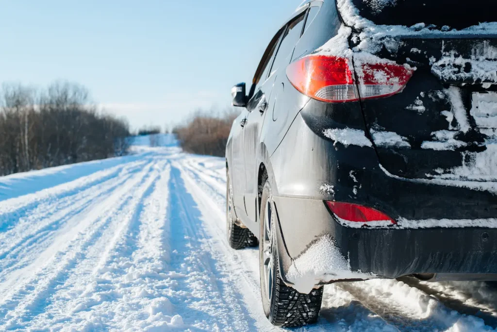 Preparing car for winter Nashville with snow and road salt buildup on vehicle exterior