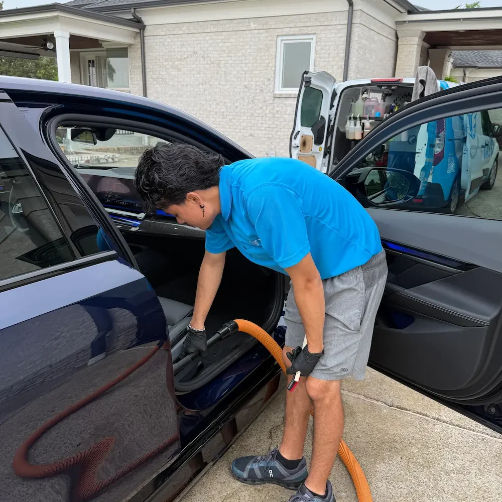 Halo Mobile Detailing technician cleaning a sedan interior in a Spring Hill driveway